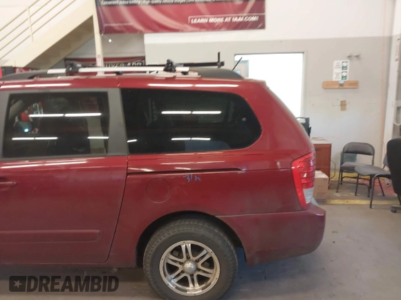 2011 Kia Sedona LX with VIN KNDMG4C78B6411157, listed as a IAAI auction lot 40671496 with 153,768 mi miles. Bid and sale history available at carsss.com. Image 6.