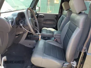 2009 Jeep Wrangler X z VIN 1J4FA24179L716499, wystawiony jako Copart lot #58342675 z przebiegiem 116 871 mil mil oraz Szkoda całkowita • Salvage title. Historia ofert i sprzedaży dostępna na DreamBid. Obrazek 7.