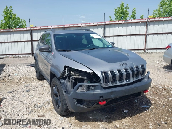 2017 Jeep Cherokee Trailhawk z VIN 1C4PJMBSXHW601720, wystawiony jako IAAI lot #42237975 z przebiegiem 92 239 mil mil oraz . Historia ofert i sprzedaży dostępna na DreamBid. Obrazek 1.