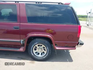 1999 Chevrolet Suburban with VIN 1GBFK16R5XJ335005, listed as a IAAI auction lot 42542755 with 200,599 mi miles and . Bid and sale history available at DreamBid. Image 6.