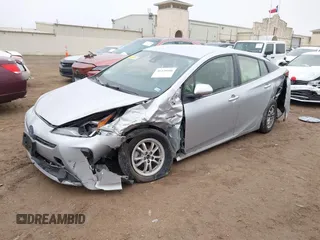 2022 Toyota Prius L Eco with VIN JTDKAMFU9N3185999, listed as a IAAI auction lot 41428106 with 50,798 mi miles. Bid and sale history available at carsss.com. Image 2.