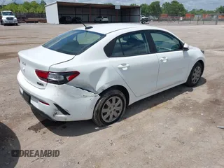 2023 Kia Rio S z VIN 3KPA24ADXPE613557, wystawiony jako IAAI lot #42198794 z przebiegiem 25 275 mil mil oraz . Historia ofert i sprzedaży dostępna na DreamBid. Obrazek 4.