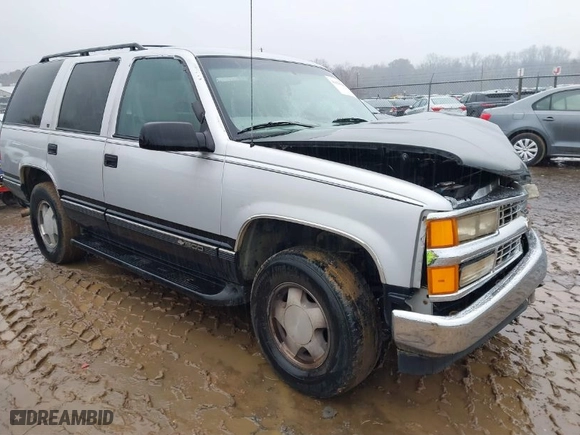 1997 Chevrolet Tahoe with VIN 1GNEK13R0VJ351919, listed as a IAAI auction lot 41028840 with 218,937 mi miles. Bid and sale history available at carsss.com. Image 1.