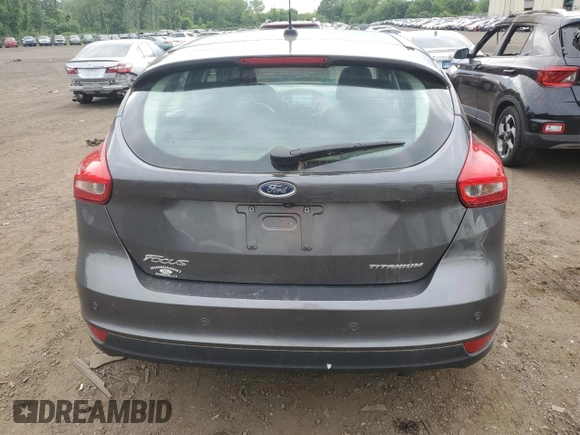 2017 Ford Focus Titanium z VIN 1FADP3N29HL240527, wystawiony jako Copart lot #62891695 z przebiegiem 126 926 mil mil oraz Szkoda całkowita • Salvage title. Historia ofert i sprzedaży dostępna na DreamBid. Obrazek 6.