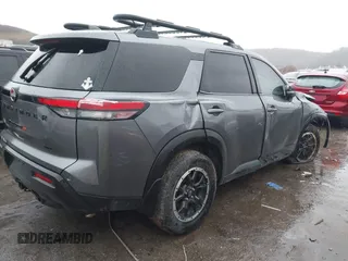 2023 Nissan Pathfinder Rock Creek with VIN 5N1DR3BD8PC275189, listed as a IAAI auction lot 41039839 with 50,058 mi miles and . Bid and sale history available at DreamBid. Image 4.