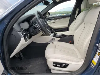 2023 BMW 5 Series M550i xDrive with VIN WBA13BK06PCM31937, listed as a Copart auction lot 66490494 with 24,972 mi miles and Salvage title. Bid and sale history available at DreamBid. Image 7.