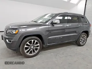 2018 Jeep Grand Cherokee Limited z VIN 1C4RJEBG3JC340061, wystawiony jako Copart lot #56654975 z przebiegiem 151 443 mil mil oraz Czysty tytuł • Clean title. Historia ofert i sprzedaży dostępna na DreamBid. Obrazek 1.