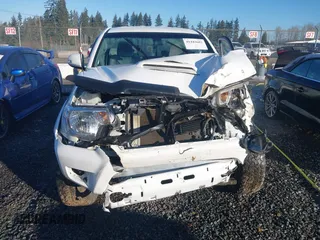 2014 Toyota Tacoma with VIN 5TFUU4EN1EX088377, listed as a IAAI auction lot 41443682 with 67,185 mi miles and . Bid and sale history available at DreamBid. Image 12.
