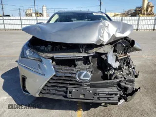 2021 Lexus NX 300 with VIN JTJGARBZ7M2191564, listed as a Copart auction lot 57974155 with 52,499 mi miles and Salvage title. Bid and sale history available at DreamBid. Image 5.