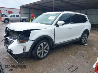 2021 Kia Telluride S with VIN 5XYP6DHC1MG103401, listed as a IAAI auction lot 42174602 with 125,118 mi miles and . Bid and sale history available at DreamBid. Image 2.