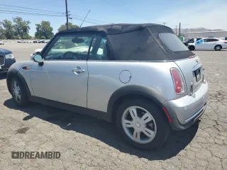 2006 MINI Convertible with VIN WMWRF33576TG16056, listed as a Copart auction lot 63127705 with 108,654 mi miles and Salvage title. Bid and sale history available at DreamBid. Image 2.