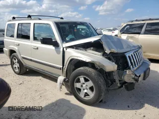 2009 Jeep Commander Sport with VIN 1J8HH48K59C514861, listed as a Copart auction lot 44076015 with 129,674 mi miles and Salvage title. Bid and sale history available at DreamBid. Image 4.