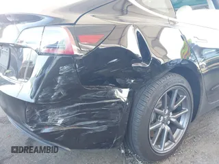 2020 Tesla Model 3 Standard Range Plus with VIN 5YJ3E1EA8LF661982, listed as a IAAI auction lot 41700109 with 30,271 mi miles and . Bid and sale history available at DreamBid. Image 6.