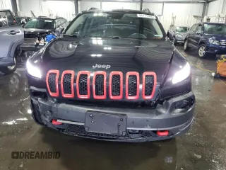 2014 Jeep Cherokee Trailhawk with VIN 1C4PJMBSXEW187981, listed as a Copart auction lot 56711885 with 157,317 mi miles and Salvage title. Bid and sale history available at DreamBid. Image 5.