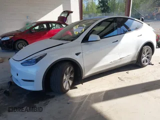 2024 Tesla Model Y Long Range with VIN 7SAYGAEEXRF988561, listed as a IAAI auction lot 42058248 with 7,845 mi miles. Bid and sale history available at carsss.com. Image 2.