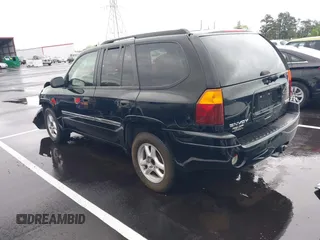 2007 GMC Envoy SLE with VIN 1GKDS13S872309605, listed as a IAAI auction lot 41946509 with 184,638 mi miles. Bid and sale history available at carsss.com. Image 3.