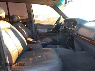 1998 Jeep Grand Cherokee Limited with VIN 1J4GX78Y8WC110325, listed as a IAAI auction lot 41357373 with 165,106 mi miles. Bid and sale history available at carsss.com. Image 5.