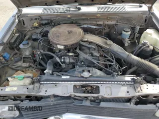 1987 Nissan Hardbody E z VIN JN6ND11SXHW014073, wystawiony jako Copart lot #78956934 z przebiegiem 381 885 mil mil oraz Szkody całkowita. Historia ofert i sprzedaży dostępna na DreamBid. Obrazek 11.
