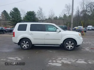 2013 Honda Pilot Touring with VIN 5FNYF4H95DB011661, listed as a IAAI auction lot 42101104 with 298,004 mi miles and . Bid and sale history available at carsss.com. Image 13.