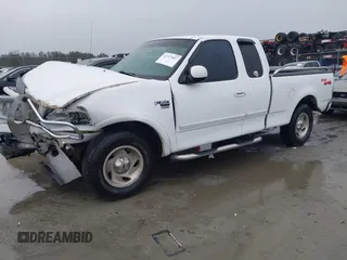 1999 Ford F-150 XL with VIN 1FTRX18L6XNB48352, listed as a IAAI auction lot 41717057 with 171,654 mi miles. Bid and sale history available at carsss.com. Image 2.