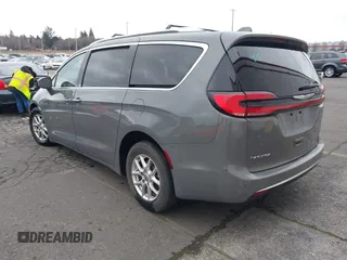 2021 Chrysler Pacifica Touring L with VIN 2C4RC1BG0MR543634, listed as a IAAI auction lot 41513467 with 148,010 mi miles and . Bid and sale history available at DreamBid. Image 3.