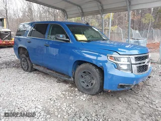2015 Chevrolet Tahoe Commercial with VIN 1GNSK2EC1FR663199, listed as a IAAI auction lot 41552787 with 148,187 mi miles. Bid and sale history available at carsss.com. Image 1.