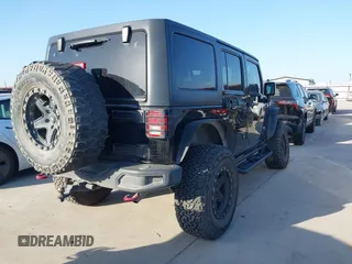 2015 Jeep Wrangler Unlimited Rubicon Hard Rock with VIN 1C4HJWFG7FL602344, listed as a IAAI auction lot 42011914 with 109,238 mi miles and . Bid and sale history available at DreamBid. Image 4.