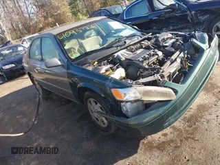 1999 Toyota Camry LE z VIN JT2BF22K0X0171352, wystawiony jako IAAI lot #40937216 z przebiegiem 158 174 mil mil oraz . Historia ofert i sprzedaży dostępna na DreamBid. Obrazek 1.