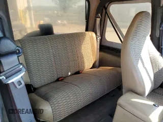 1999 Jeep Wrangler Sport with VIN 1J4FY19S6XP445867, listed as a Copart auction lot 62223125 with 146,037 mi miles and Salvage title. Bid and sale history available at DreamBid. Image 11.