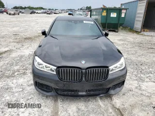 2019 BMW 7 Series 750i with VIN WBA7F0C57KGM25906, listed as a Copart auction lot 62728443 with 61,561 mi miles. Bid and sale history available at carsss.com. Image 5.