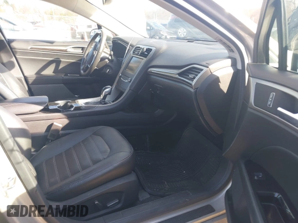 2015 Ford Fusion SE Hybrid with VIN 3FA6P0LUXFR133979, listed as a IAAI auction lot 41831288 with 143,738 mi miles. Bid and sale history available at carsss.com. Image 5.