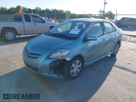 2007 Toyota Yaris with VIN JTDBT923371029654, listed as a IAAI auction lot 42142361 with 296,107 mi miles. Bid and sale history available at carsss.com. Image 2.