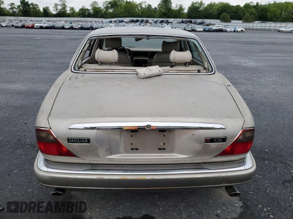 1995 Jaguar XJ with VIN SAJHX174XSC738856, listed as a Copart auction lot 57768915 with Not provided miles and Salvage title. Bid and sale history available at DreamBid. Image 6.