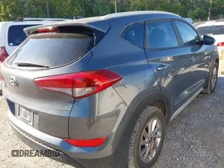 2017 Hyundai Tucson SE with VIN KM8J33A48HU413430, listed as a IAAI auction lot 41993667 with 150,736 mi miles and . Bid and sale history available at DreamBid. Image 4.