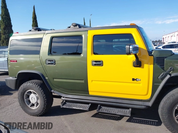 2003 Hummer H2 z VIN 5GRGN23UX3H124727, wystawiony jako IAAI lot #41697787 z przebiegiem 241 554 mil mil oraz . Historia ofert i sprzedaży dostępna na DreamBid. Obrazek 13.