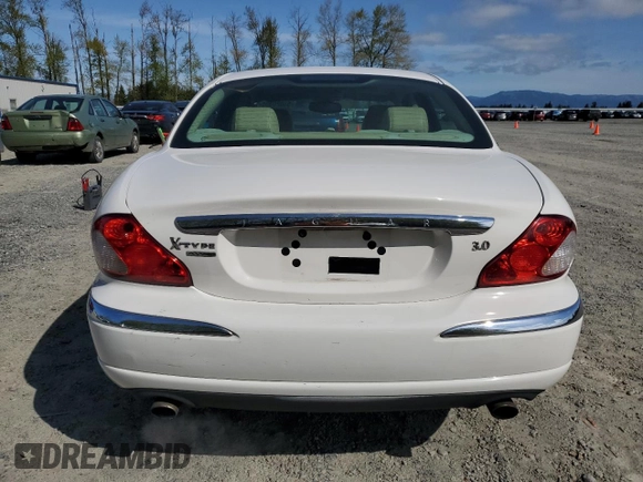 2006 Jaguar X-Type with VIN SAJWA51A06WE68591, listed as a Copart auction lot 53020355 with 179,379 mi miles and Salvage Title. Bid and sale history available at DreamBid. Image 6.