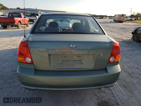 2005 Hyundai Accent GLS with VIN KMHCG45C35U595666, listed as a Copart auction lot 88294365 with 70,497 mi miles and Salvage Title. Bid and sale history available at carsss.com. Image 6.