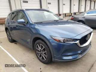 2018 Mazda CX-5 Grand Touring with VIN JM3KFADM8J1351624, listed as a Copart auction lot 50965465 with 66,210 mi miles and Salvage Title. Bid and sale history available at DreamBid. Image 4.