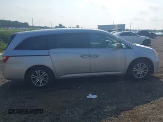 2012 Honda Odyssey EX-L with VIN 5FNRL5H65CB039015, listed as a IAAI auction lot 42612886 with 216,955 mi miles and . Bid and sale history available at DreamBid. Image 13.