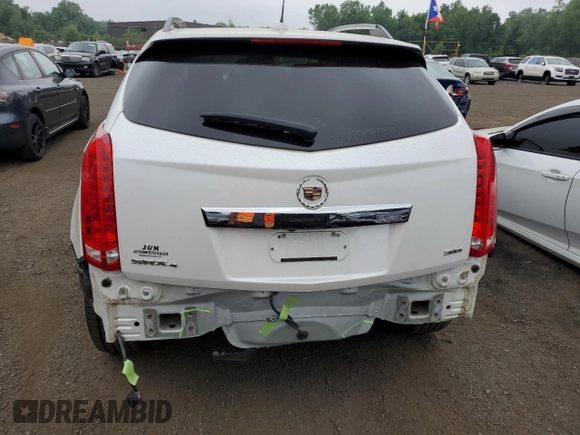 2015 Cadillac SRX Premium Collection with VIN 3GYFNGE32FS528514, listed as a Copart auction lot 61222534 with 104,433 mi miles and Salvage Title. Bid and sale history available at carsss.com. Image 6.