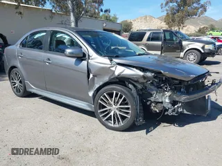2017 Mitsubishi Lancer ES with VIN JA32V2FW3HU009943, listed as a IAAI auction lot 41706971 with 85,606 mi miles. Bid and sale history available at carsss.com. Image 1.
