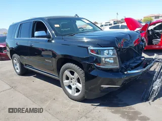 2015 Chevrolet Tahoe LTZ z VIN 1GNSKCKC7FR715512, wystawiony jako IAAI lot #42054583 z przebiegiem 106 941 mil mil oraz . Historia ofert i sprzedaży dostępna na DreamBid. Obrazek 1.