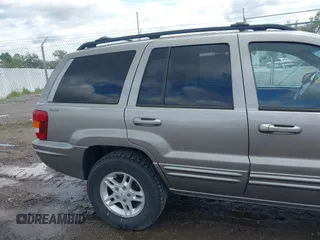 1999 Jeep Grand Cherokee Limited z VIN 1J4GW68N3XC597468, wystawiony jako IAAI lot #42353732 z przebiegiem 201 388 mil mil oraz . Historia ofert i sprzedaży dostępna na DreamBid. Obrazek 12.