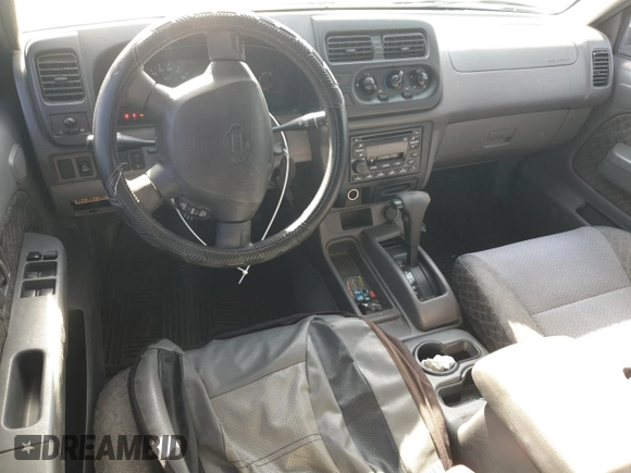 2001 Nissan Xterra XE with VIN 5N1ED28T91C541628, listed as a Copart auction lot 57712125 with 104,738 mi miles and Salvage title. Bid and sale history available at DreamBid. Image 8.