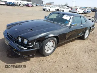 1989 Jaguar XJS with VIN SAJNA5840KC151334, listed as a IAAI auction lot 41702577 with 113,000 mi miles and . Bid and sale history available at DreamBid. Image 2.