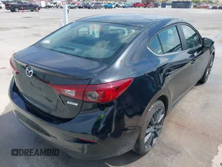 2018 Mazda 3 Touring with VIN 3MZBN1V32JM208914, listed as a IAAI auction lot 42066757 with 111,249 mi miles and . Bid and sale history available at DreamBid. Image 4.