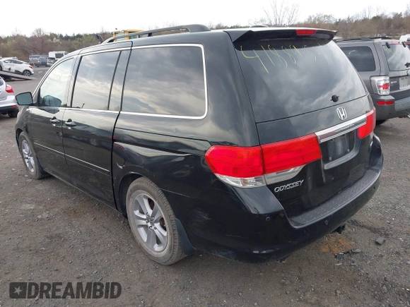 2010 Honda Odyssey Touring with VIN 5FNRL3H95AB040354, listed as a IAAI auction lot 41889501 with 155,069 mi miles. Bid and sale history available at carsss.com. Image 3.
