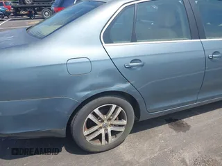 2006 Volkswagen Jetta 1.9L TDI z VIN 3VWST71K66M834544, wystawiony jako IAAI lot #42557527 z przebiegiem Nie podano mil oraz . Historia ofert i sprzedaży dostępna na DreamBid. Obrazek 6.