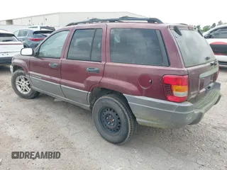 2003 Jeep Grand Cherokee Laredo with VIN 1J4GX48S83C576892, listed as a IAAI auction lot 42082865 with 212,157 mi miles. Bid and sale history available at carsss.com. Image 3.