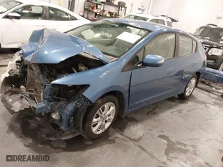 2010 Honda Insight EX with VIN JHMZE2H7XAS032982, listed as a IAAI auction lot 41449736 with 61,773 mi miles. Bid and sale history available at carsss.com. Image 18.